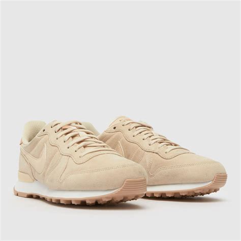 beige nike trainers women's.